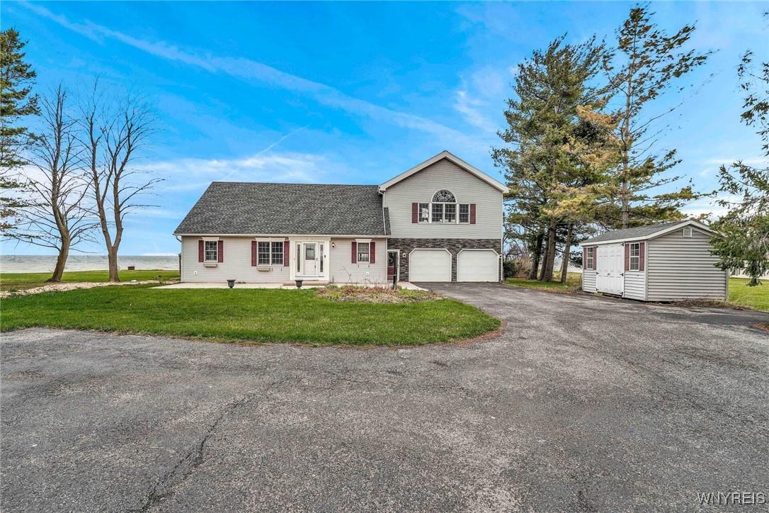 Image 2: Set far back from the road with plenty of garage a