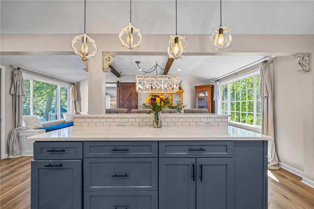 Image 4: Updated kitchen with quartz countertop