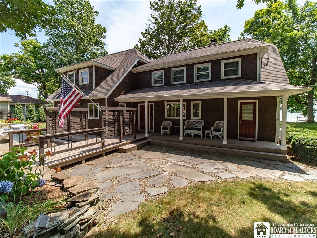 Image 3: Stone patio...door to the primary bedroom/bath