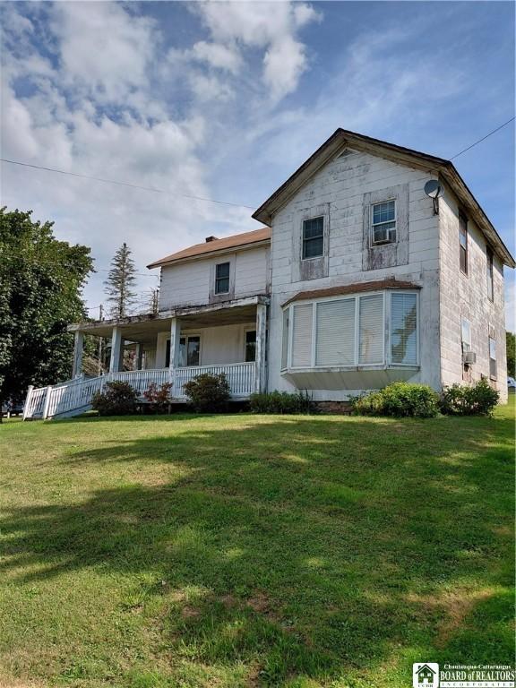 Image 1: House from front sidewalk.