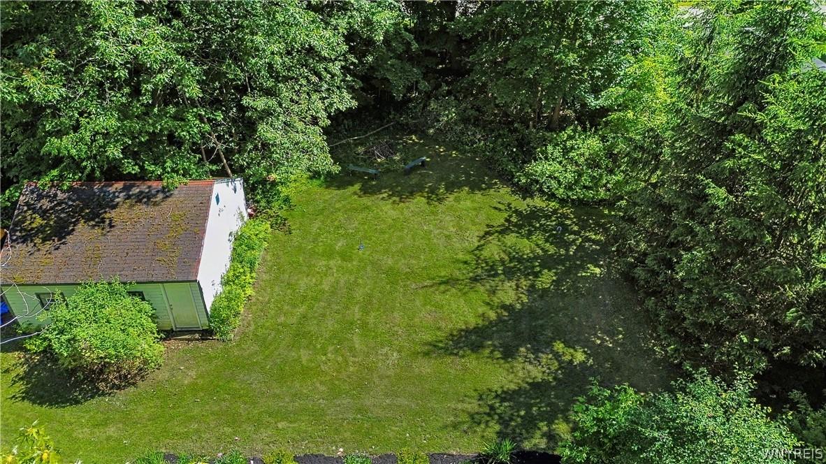 Image 2: Large, open yard behind garage.