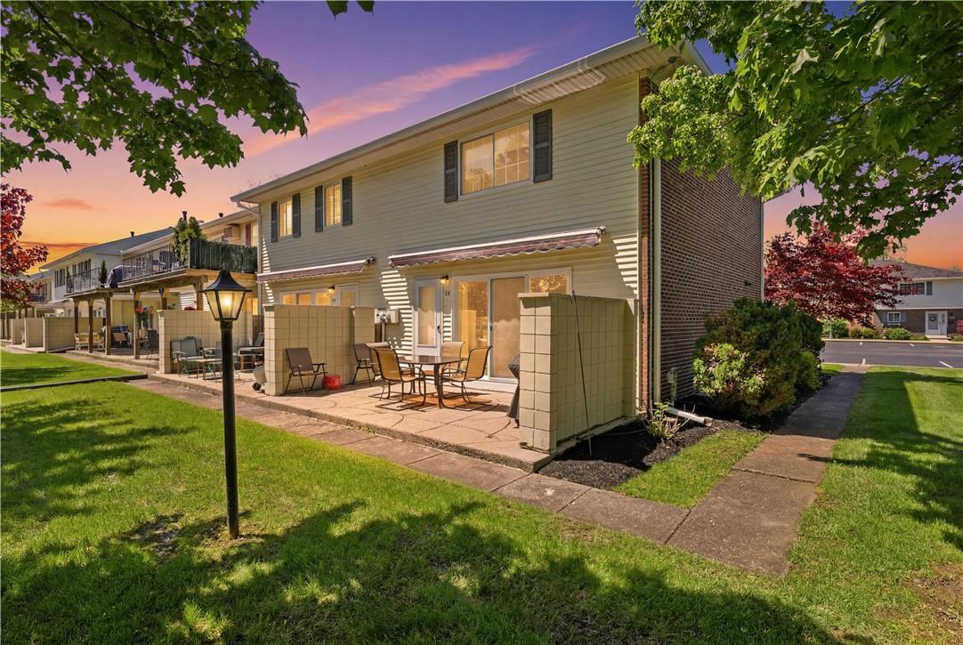 Image 2: Rear view of 142 Holiday Harbour, Canandaigua. Nic