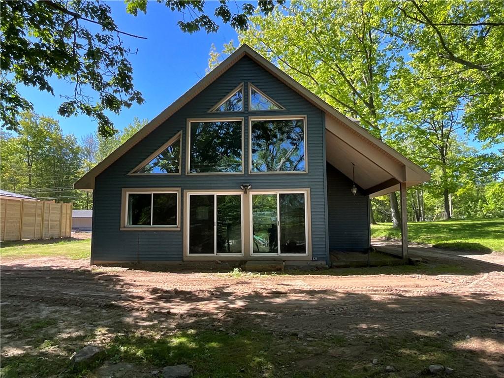 Image 1: View of the back side of the house that overlooks