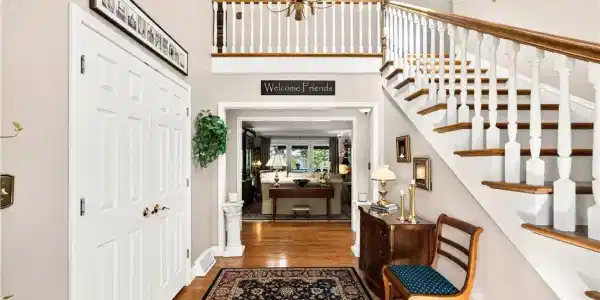 Image 4: The foyer opens to spacious living areas filled wi