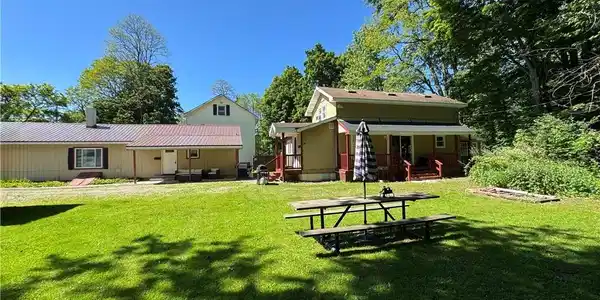 Image 4: Both homes side view