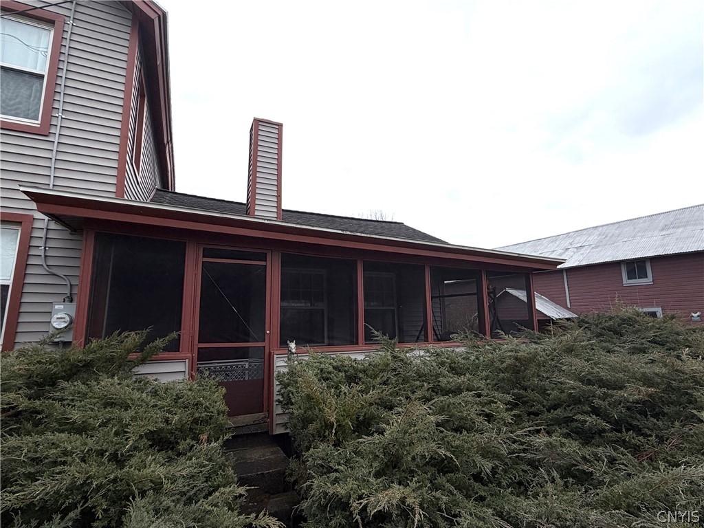 Image 2: front screened in porch