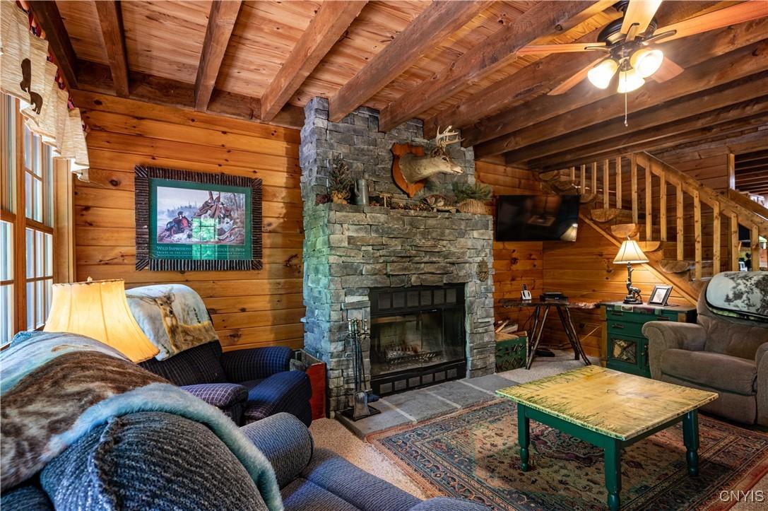 Image 4: Living Room with Wood Burning Fireplace