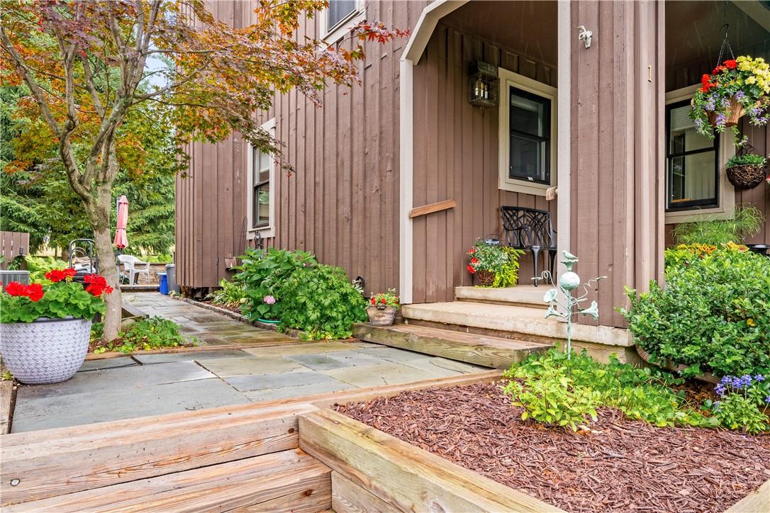 Image 3: Covered Front Porch and slate walkway to Patio & B