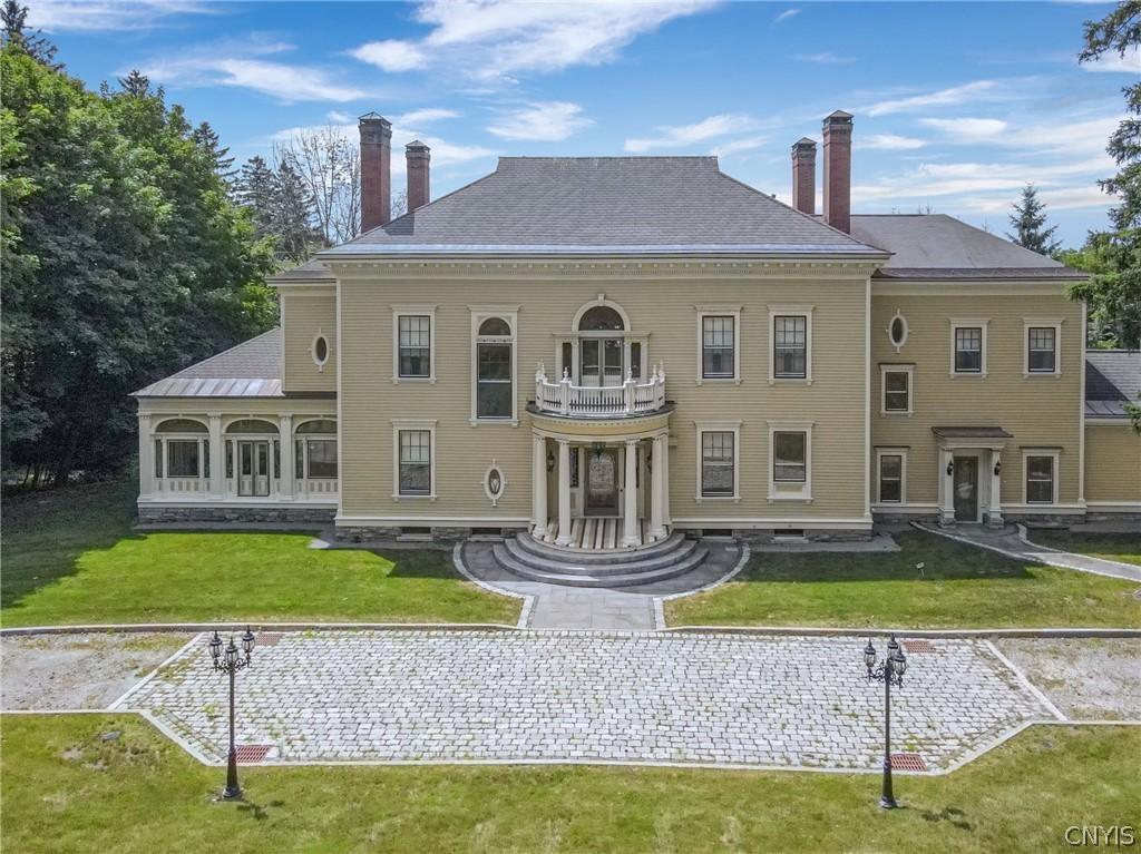 Image 3: Grand entryway off of the circular driveway on the