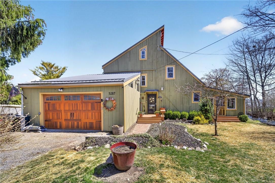 Image 3: Entrance and 2 car garage