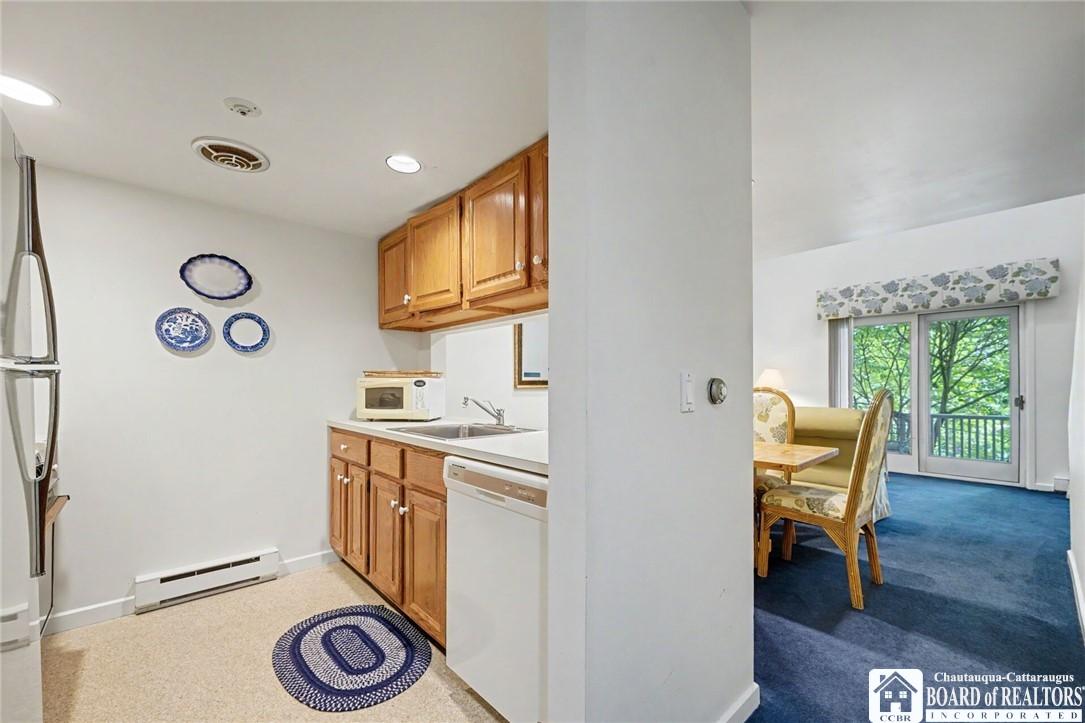 Image 2: Kitchen overlooking Dining/Living