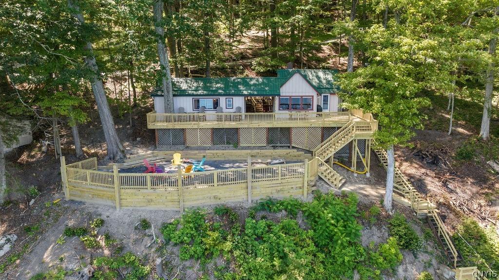Image 2: Aerial - deck and firepit entertainment area.