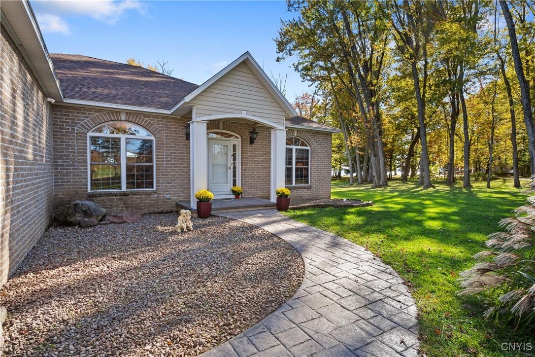Image 3: The stamped concrete walkway is both beautiful and