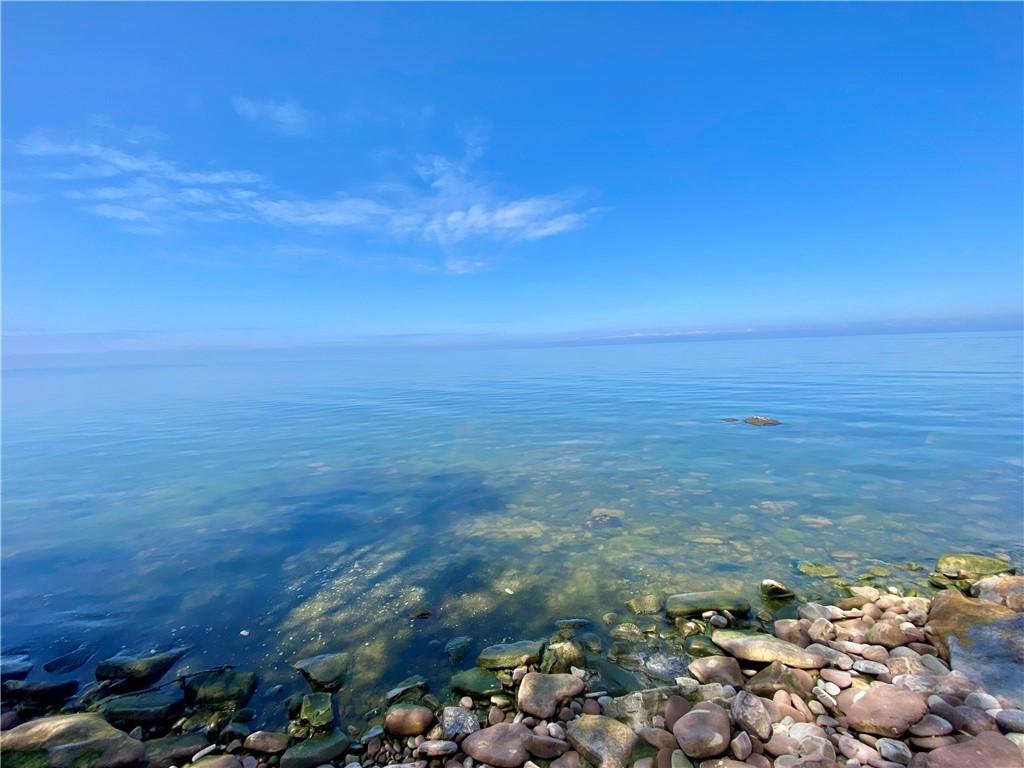 Image 3: PRIME PRIVATE ACRE WITH 115' STONE BEACH