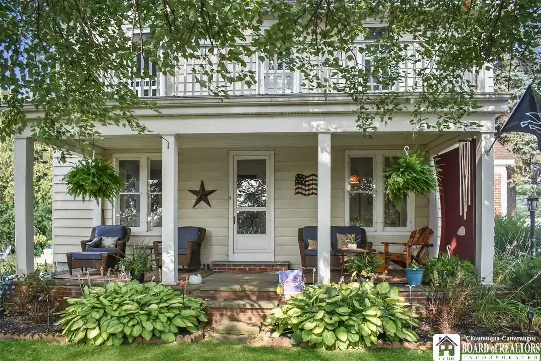 Image 1: Covered side porch facing Ellery Park.