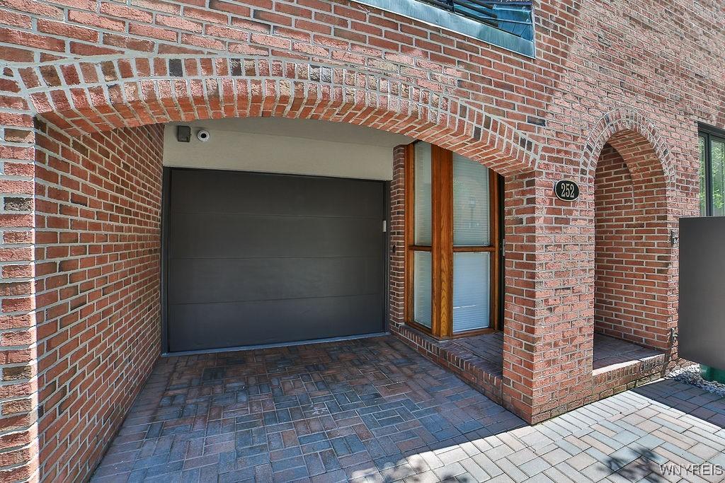 Image 3: Attached 1 car garage with room for a car in the d