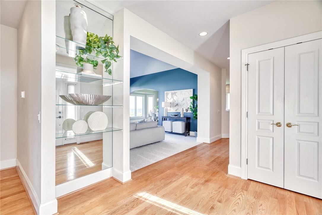 Image 4: Spacious sunlit foyer/entry with views of the lake