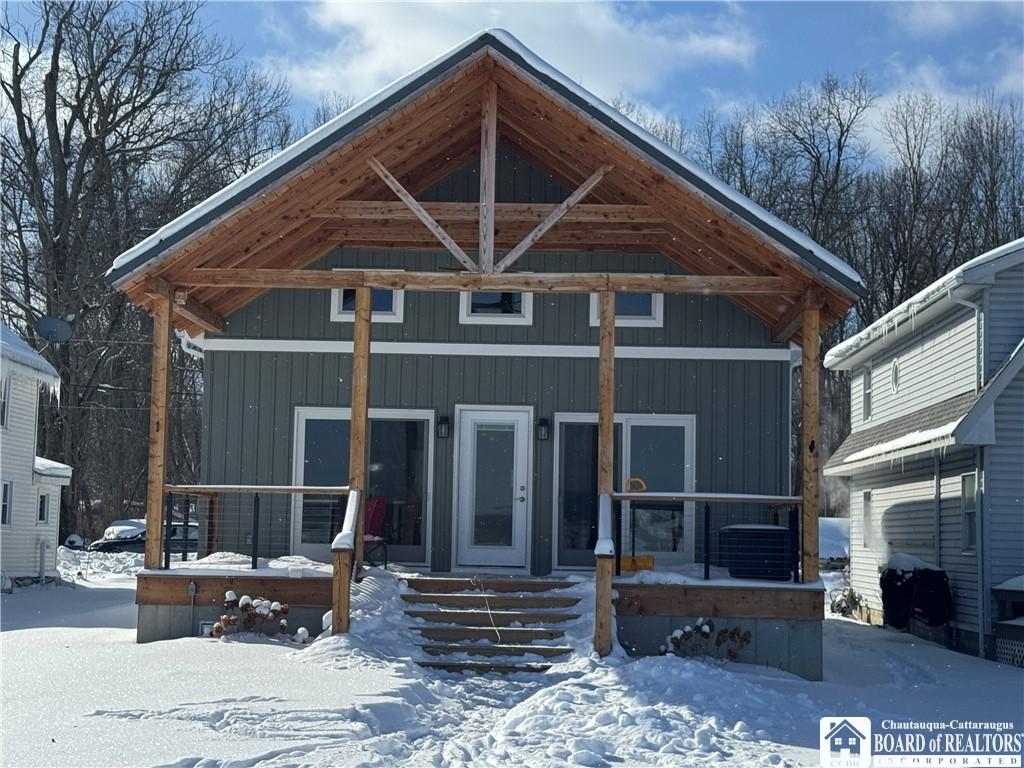 Image 4: The view of the house from the lake showcases a la