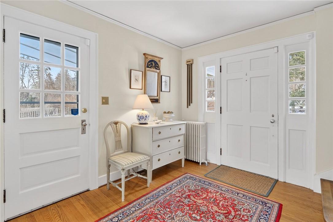 Image 3: foyer with main door and door to covered porch