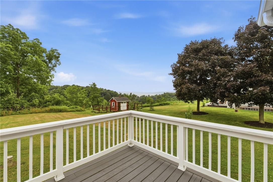 Image 3: Distant lakeviews from the back deck is enjoyable