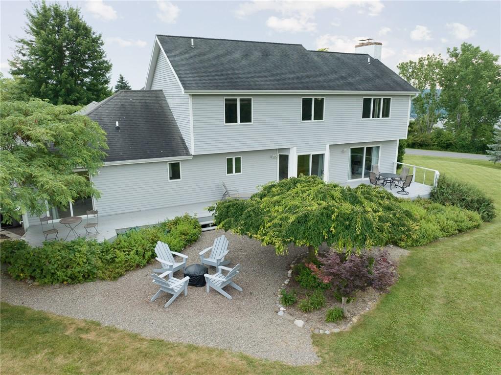 Image 3: Back yard, with deck and gravel area for added ent
