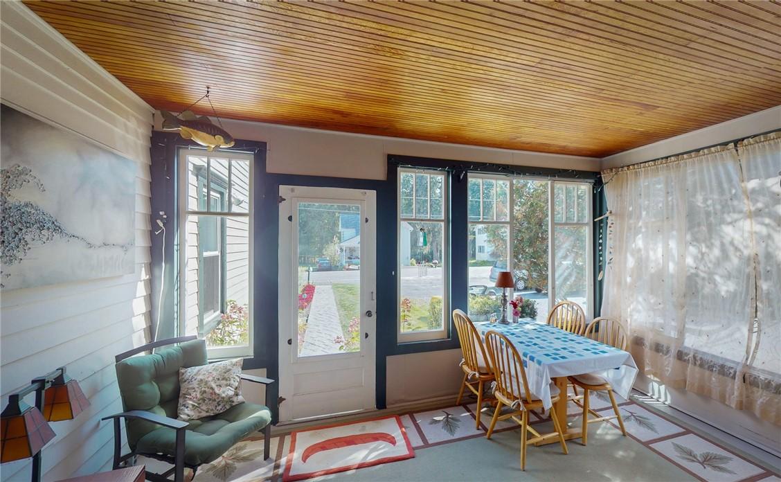 Image 4: Delightful enclosed sun porch invites the perfect