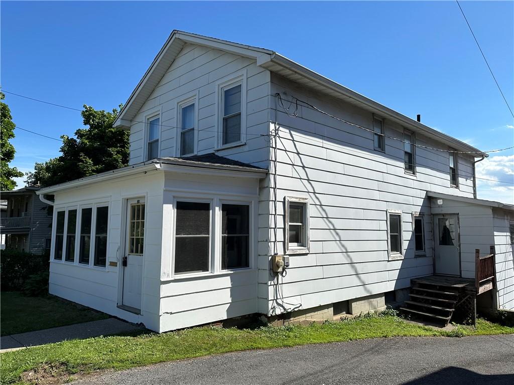 Image 2: Side porch with laundry and pantry storage