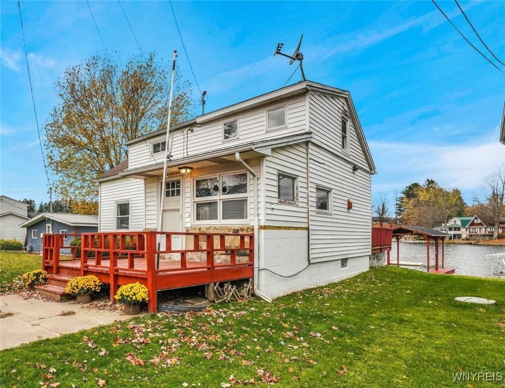 Image 2: Street side view of entry and deck