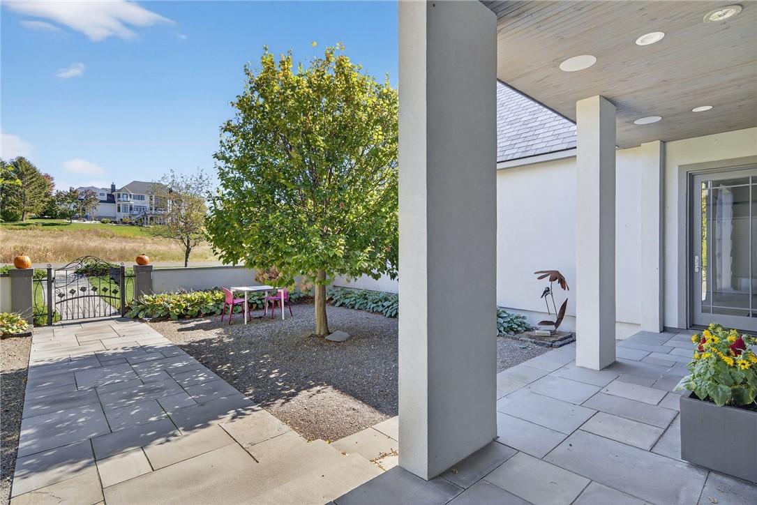 Image 3: Gated entry with courtyard space at the front yard