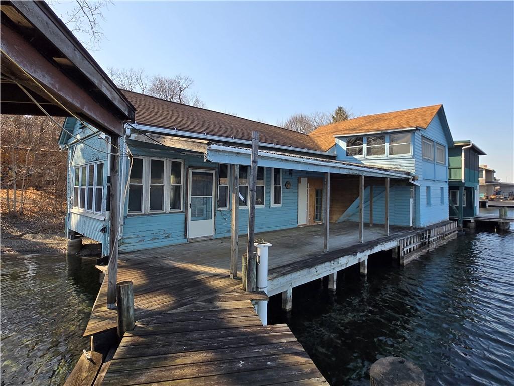 Image 1: Cottage Positioned Directly Over Seneca Lake. The