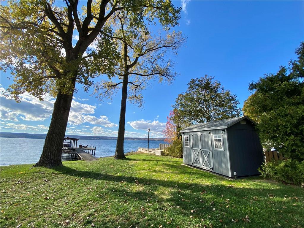 Image 3: Lake frontage with shed