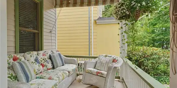 Image 4: Enjoy your time on your comfortable covered porch.