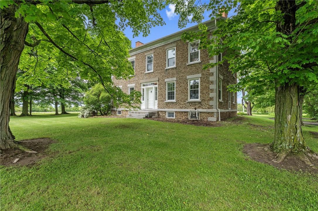 Image 1: 901 Sherwood Road, Aurora, NY sits on the ridge ab