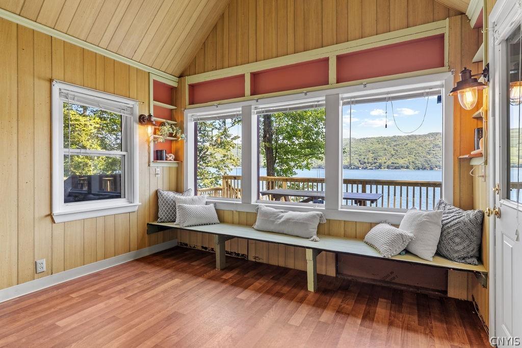 Image 3: Bldg 1 - living room with fireplace and kitchen.