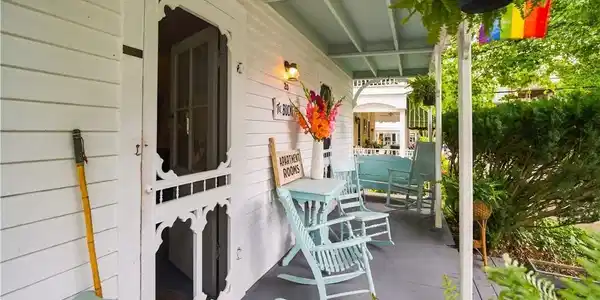 Image 3: Welcome to the porch with two entrances leading to