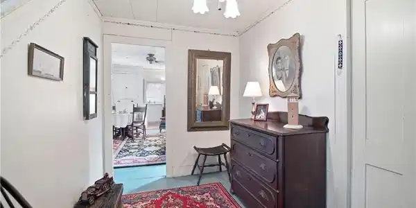 Image 4: The larger of two units entrance with front foyer.
