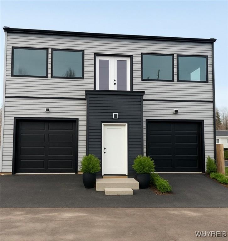 Image 1: Front entrance staged with greenery using AI,
 or