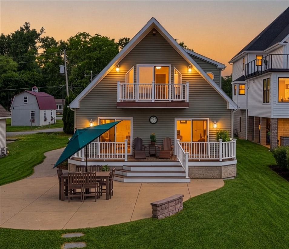 Image 1: Welcome to 5791 Joy Rd! Twilight view of the lakef