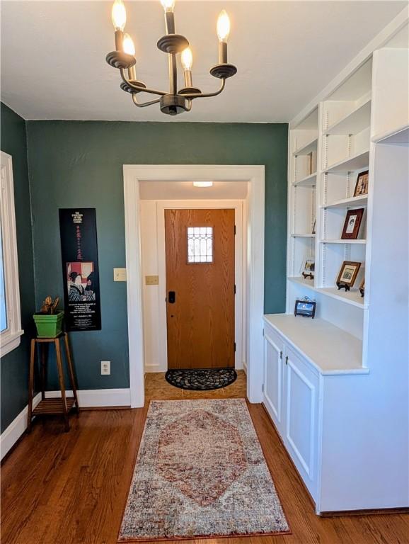 Image 3: front entrance with built in bookshelves