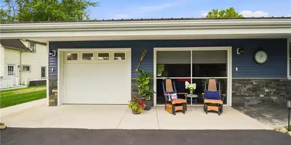 Image 3: An oversized 2 car garage offers generous room for