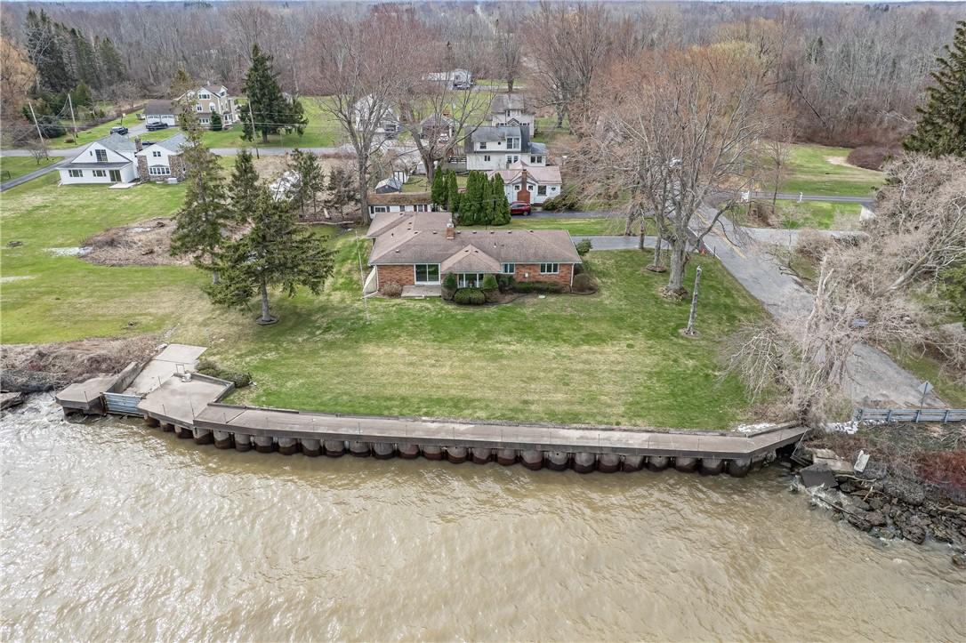 Image 2: Steel wall with concrete cap.  There are tracks th