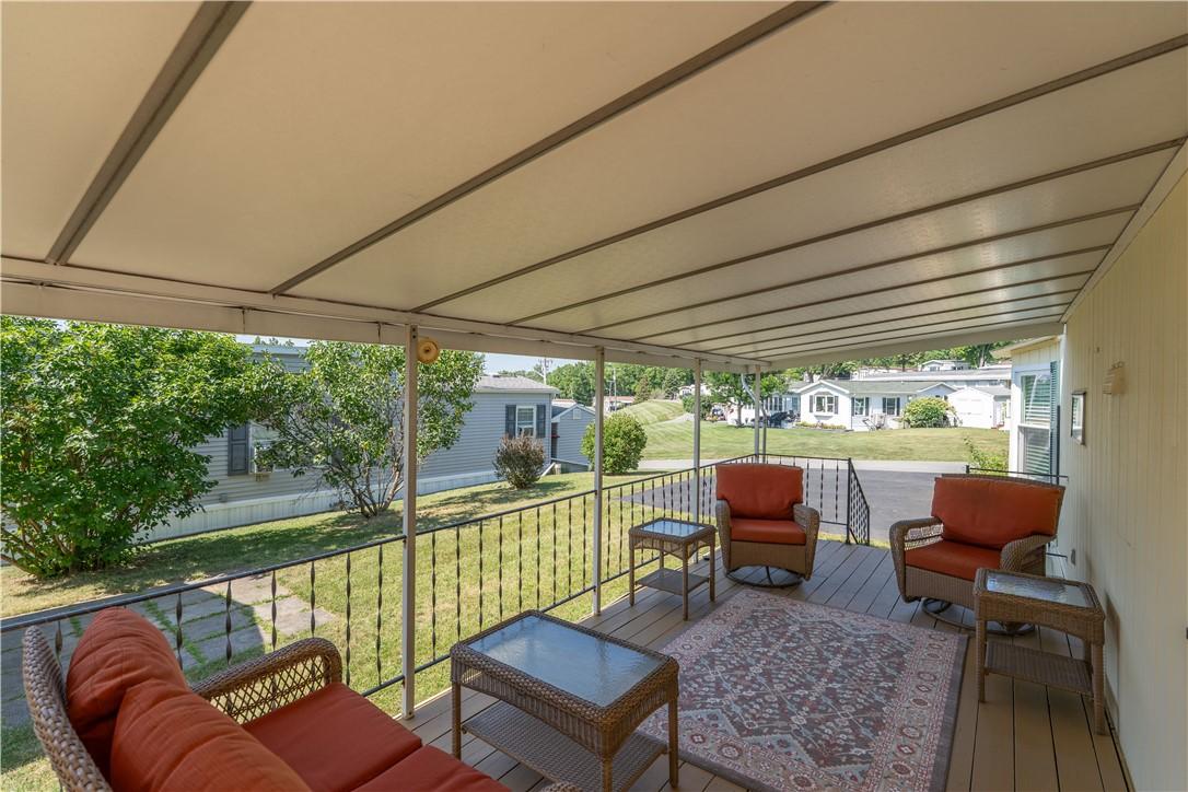 Image 3: Large covered porch freshly painted