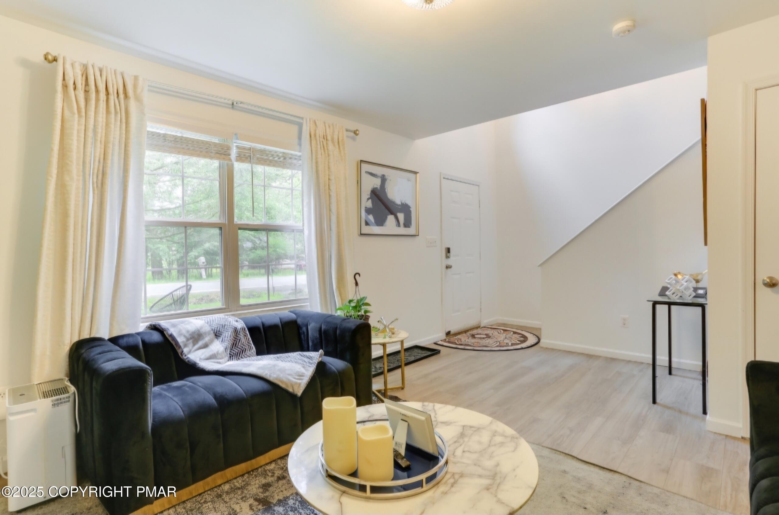 Image 3: Entry Level Living Room Overlooking Lake
