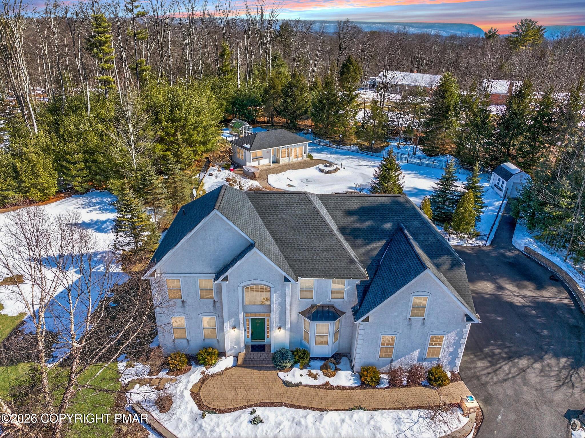 Image 4: Enhanced Aerial Front View Pool House