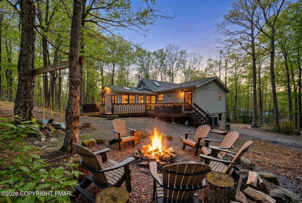 Image 3: Tree-Lined Backyard w/ Fire Pit