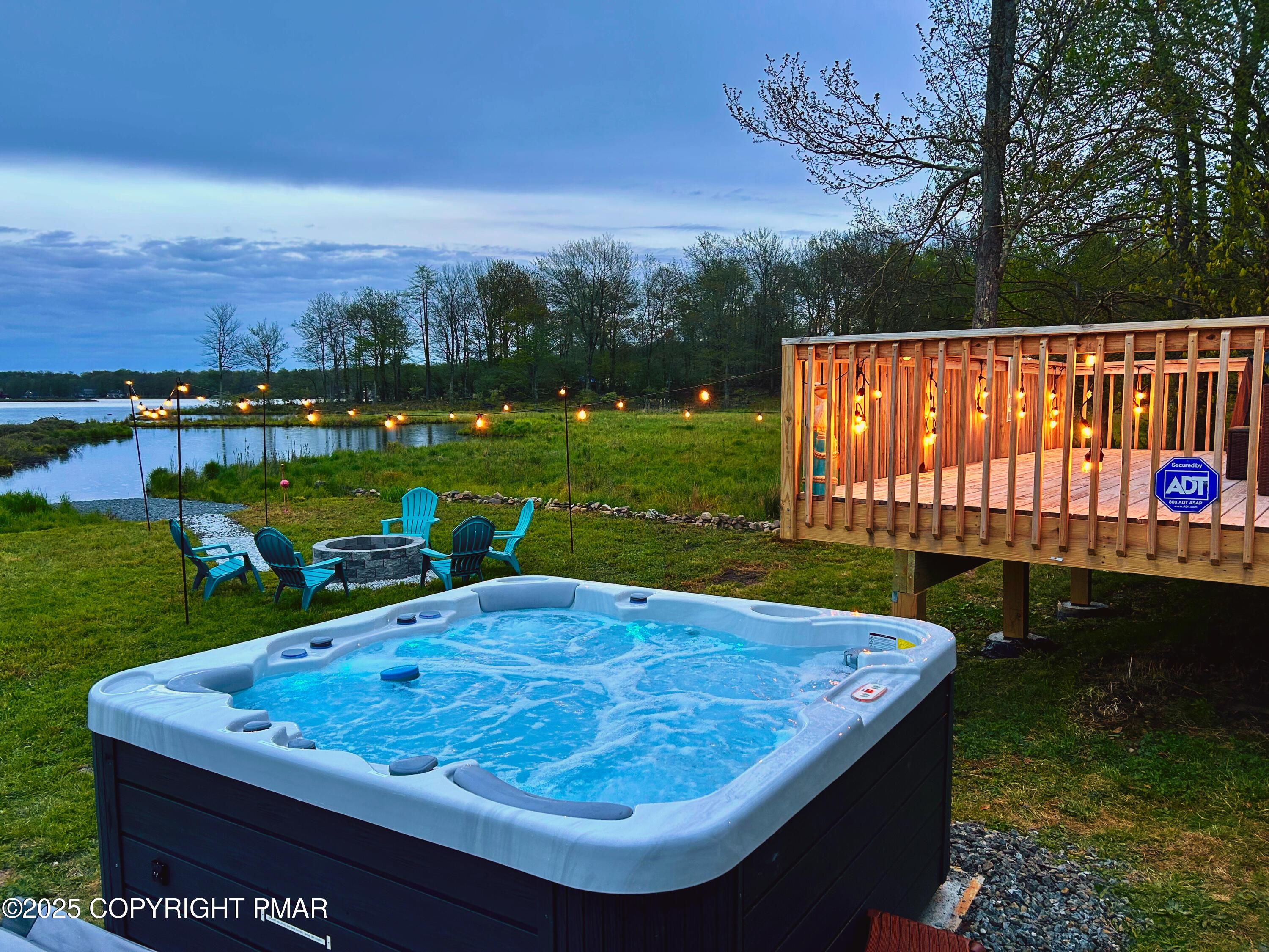 Image 3: Hot Tub overlooking water