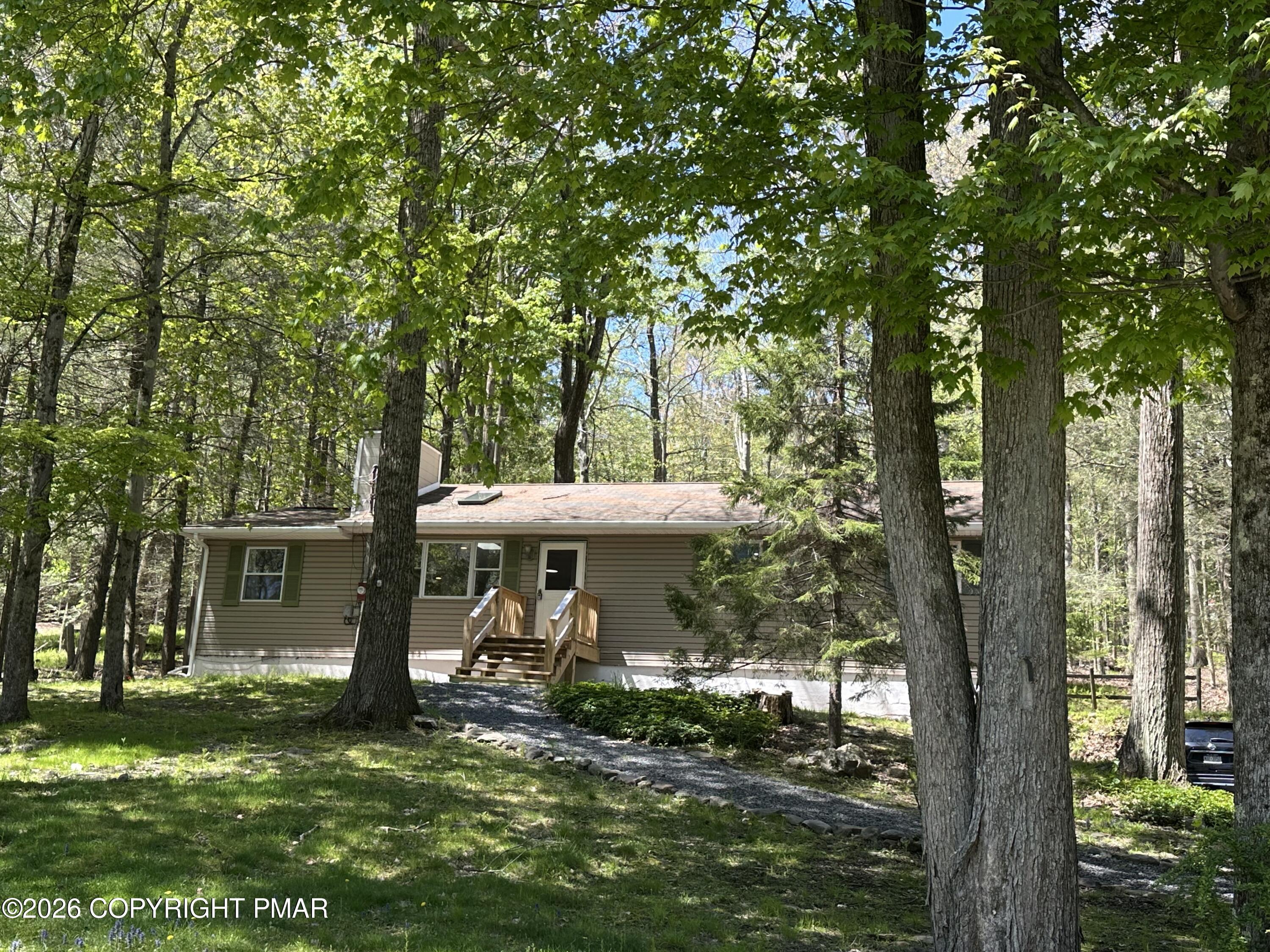 Image 1: Spring front of house