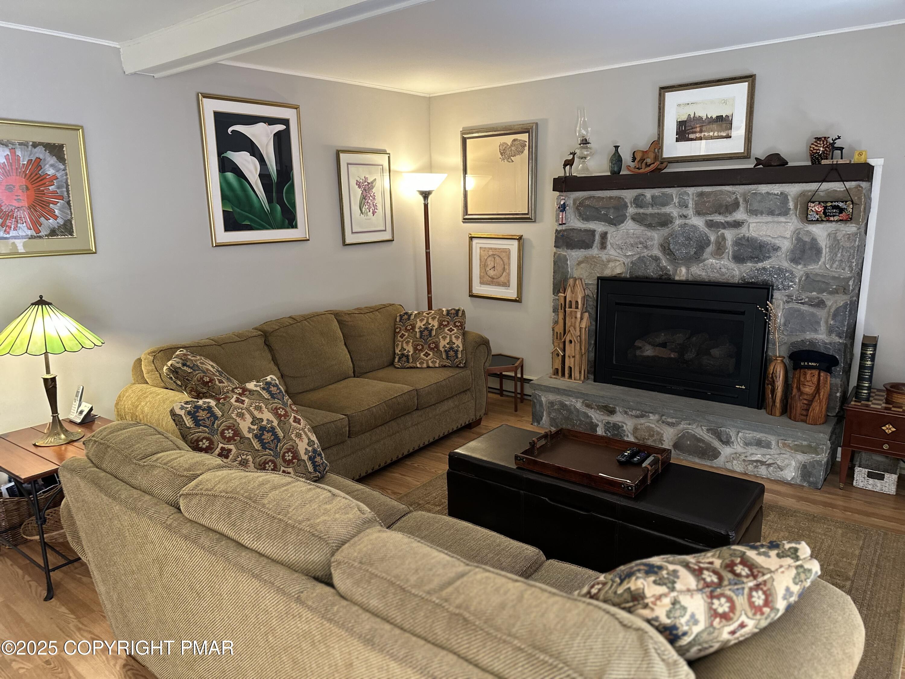 Image 2: Living Room stone gas fireplace