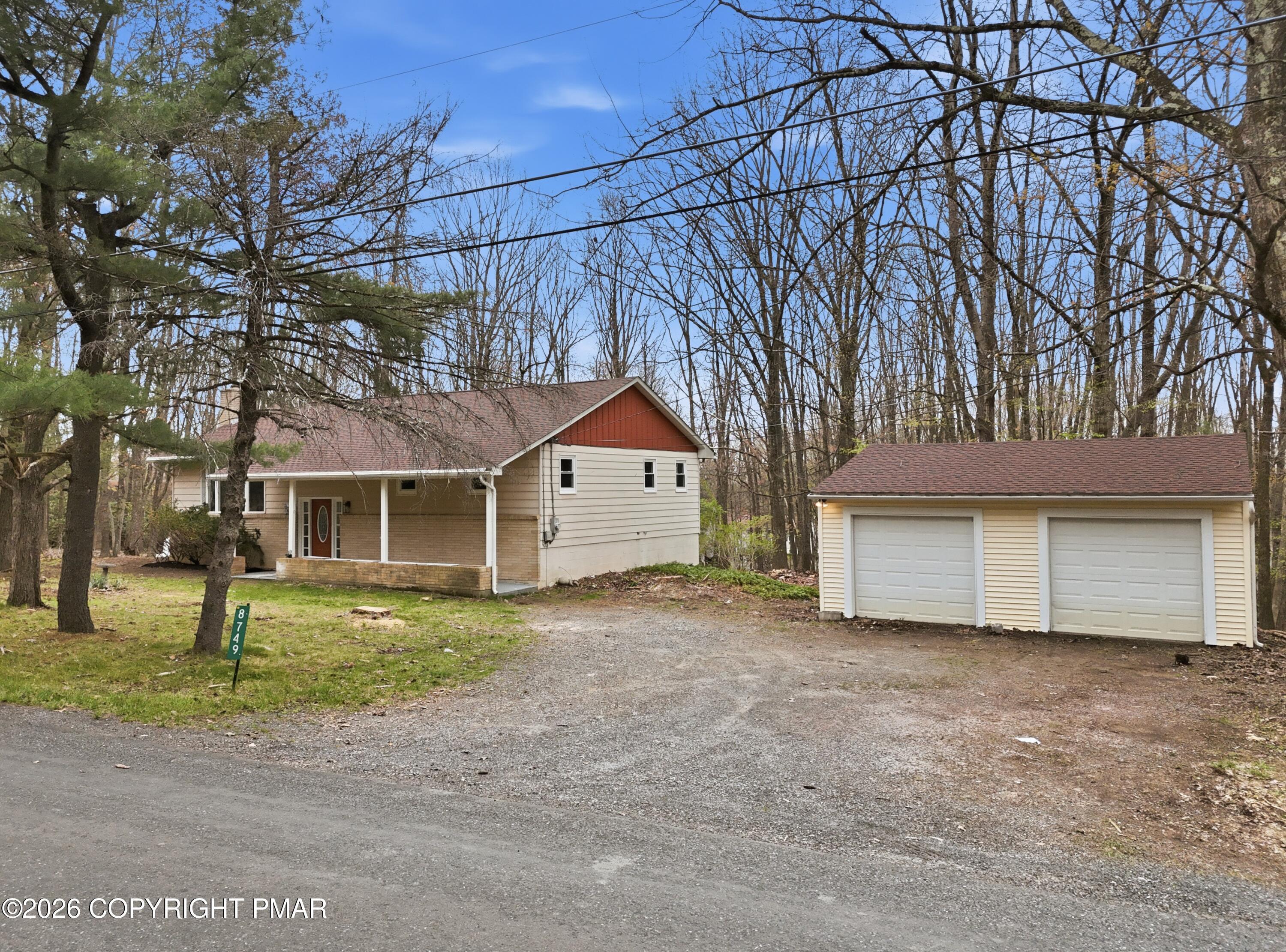 Image 4: House and garage