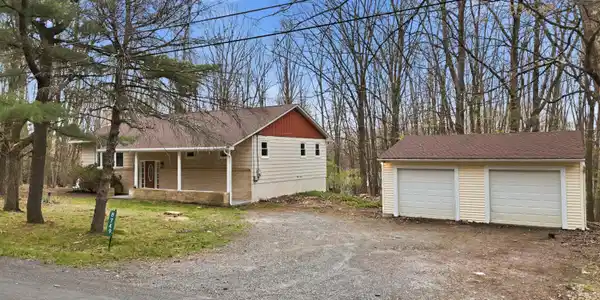 Image 4: House and garage